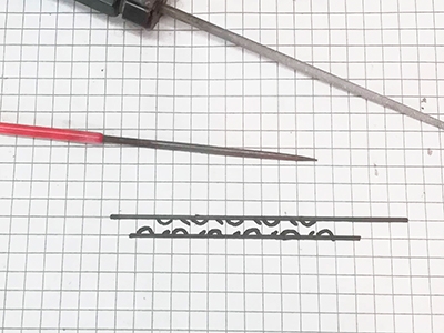 Trinn 57 Dekorative filinger i tinnplatene